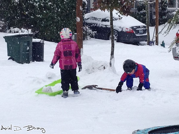 Little kids playing in the snow Little kids playing in the snow